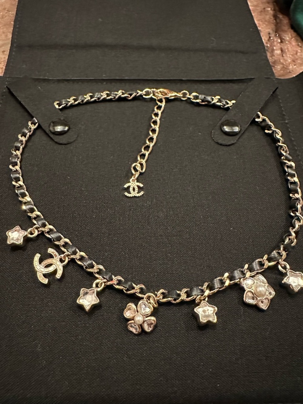 CHANEL Gold and Black Chain Necklace with Floral and Star Charms